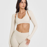 SoftMotion™ Long Sleeve Shrug with White Logo | Sand