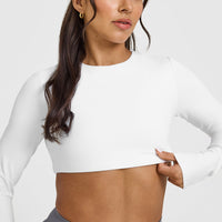 SoftMotion™ Long Sleeve Crop Top with White Logo | White