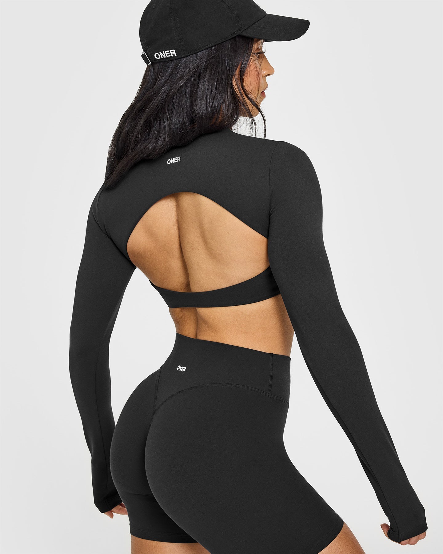 SoftMotion™ Long Sleeve Crop Top with White Logo | Soft Black