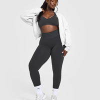 Effortless Seamless Racer Back Sports Bra with White Logo | Coal