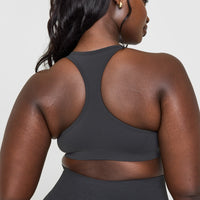 Effortless Seamless Racer Back Sports Bra with White Logo | Coal