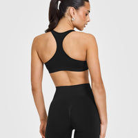 Effortless Seamless Racer Back Sports Bra with White Logo | Black