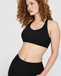 SoftMotion™ Sports Bra with White Logo | Black