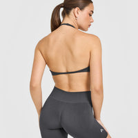 EnhanceLift™ Seamless Minimal Halter Neck Bralette with White Logo | Coal