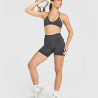 EnhanceLift™ Seamless Minimal Halter Neck Bralette with White Logo | Coal