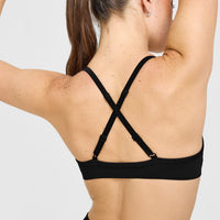 EnhanceLift™ Seamless Strappy Sports Bra with White Logo | Black