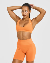 Effortless Seamless Halter Neck Sports Bra with White Logo | Apricot Orange