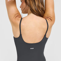 SoftMotion™ Strappy Mid Vest with Built in Bra Shelf with White Logo | Coal