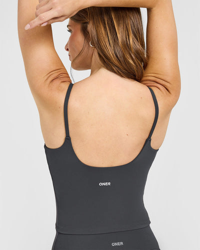 SoftMotion™ Strappy Mid Vest with Built in Bra Shelf with White Logo | Coal