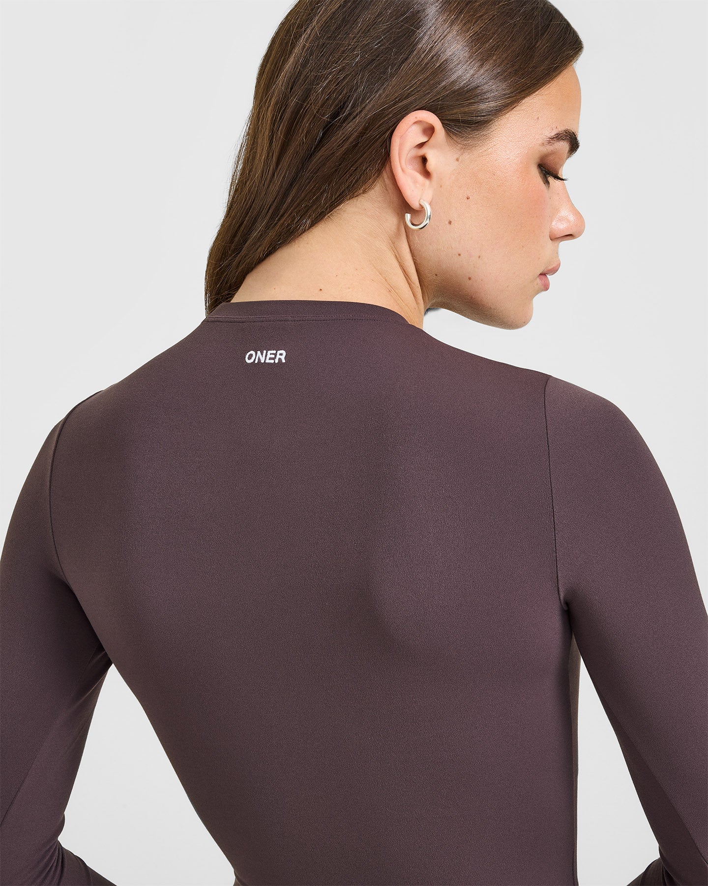 SoftMotion™ Long Sleeve Top with White Logo | Dark Umber Brown