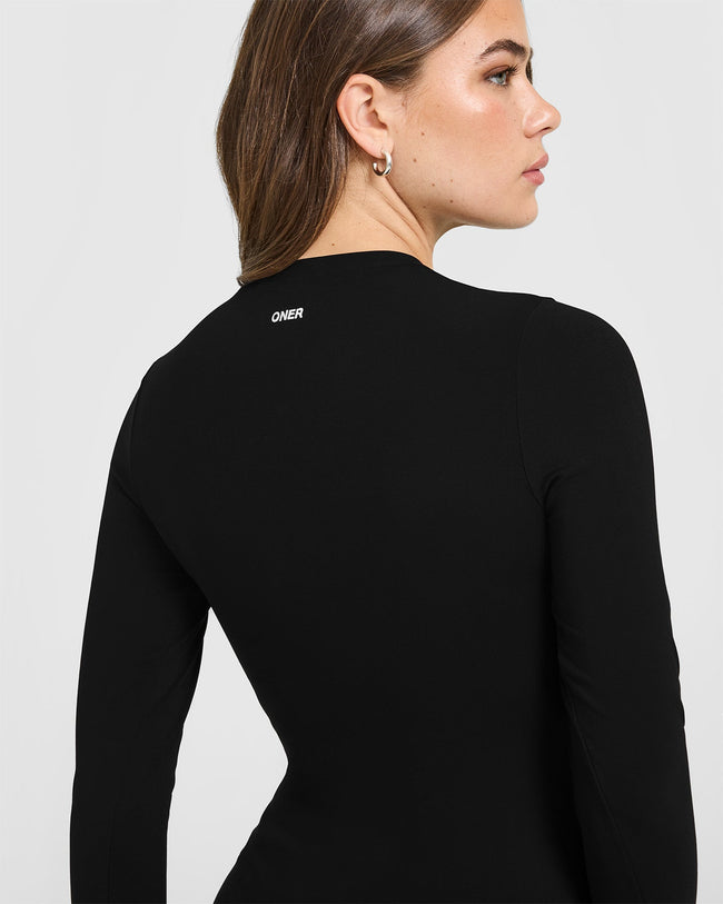 SoftMotion™ Long Sleeve Top with White Logo | Black