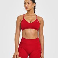 EnhanceLift™ Seamless Strappy Sports Bra with White Logo | Light Toasted Red