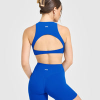 SoftMotion™ High Neck Sports Bra with White Logo | Light Cobalt Blue