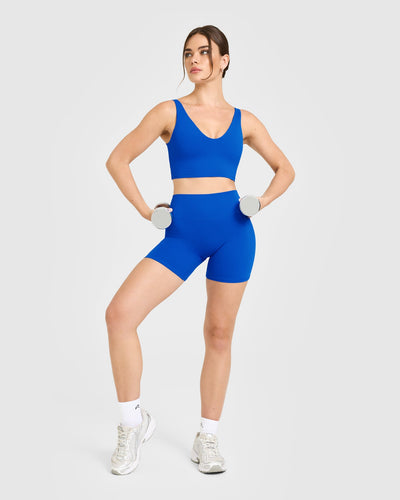 SoftMotion™ Longline Sports Bra with White Logo | Light Cobalt Blue