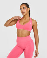 Effortless Seamless Halter Neck Sports Bra with White Logo | Hot Girl Pink