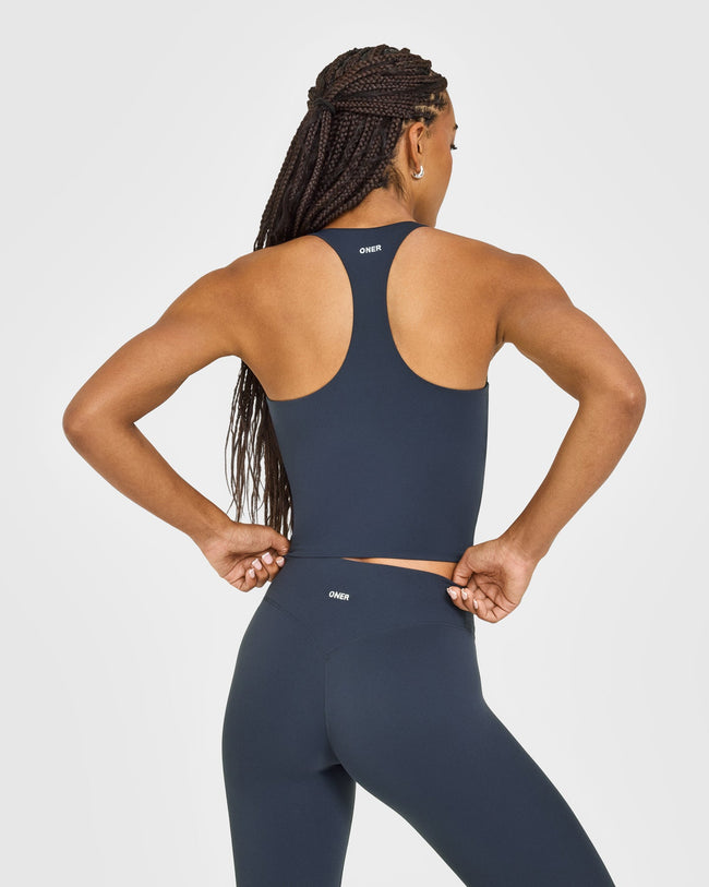 SoftMotion™ Racer Back Mid Vest with Built in Bra Shelf with White Logo | True Blue
