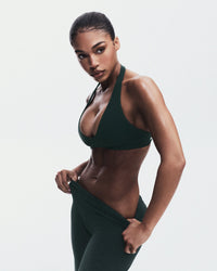 SoftMotion™ Minimal Halter Neck Bralette with Grey Logo | Emerald Noir