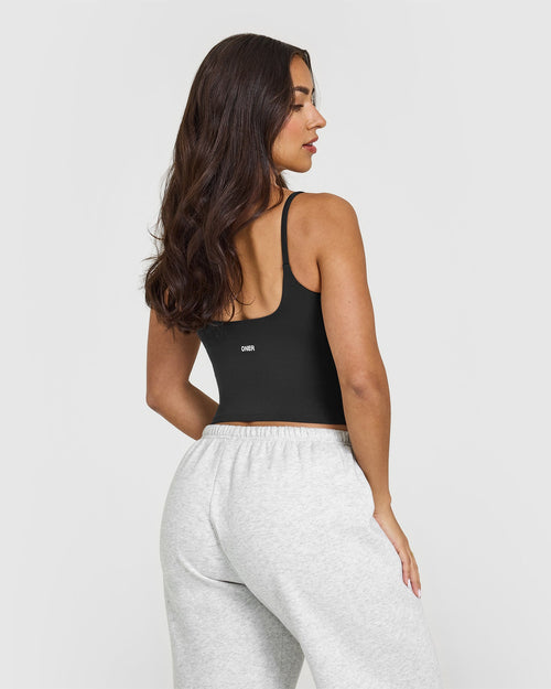 SoftMotion™ Strappy Mid Vest with Built in Bra Shelf with White Logo | Soft Black