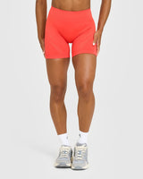 EnhanceLift™ Seamless Shorts with White Logo | Charged Coral