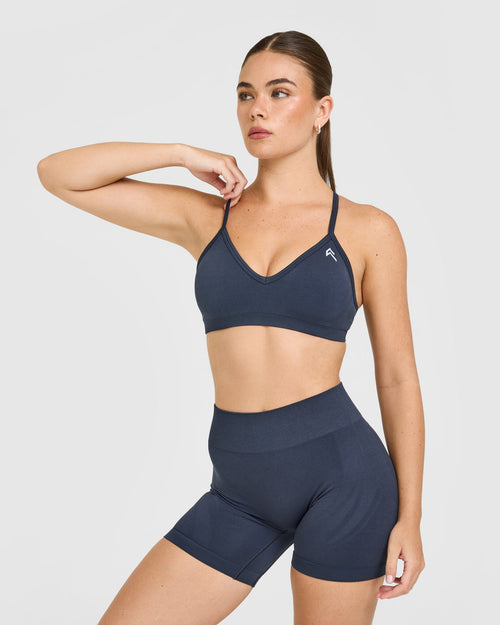Oner Modal EnhanceLift™ Seamless Strappy Sports Bra with White Logo | True Blue