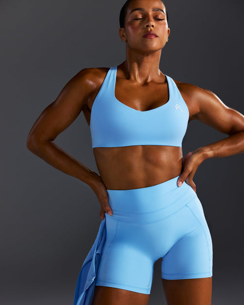 EasyLift™ Cross Back Sports Bra with White Logo | Arctic Blue