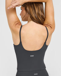 SoftMotion™ Strappy Mid Vest with Built in Bra Shelf with White Logo | Coal