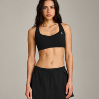 EasyLift™ Cross Back Sports Bra with Grey Logo | Black