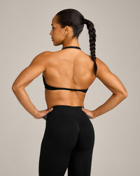 EnhanceLift™ Seamless Minimal Halter Neck Bralette with Grey Logo | Black