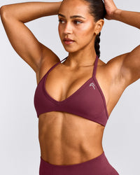 EnhanceLift™ Seamless Minimal Halter Neck Bralette with Gray Logo | Burnt Maroon Red
