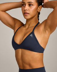 EnhanceLift™ Seamless Minimal Halter Neck Bralette with Grey Logo | True Blue