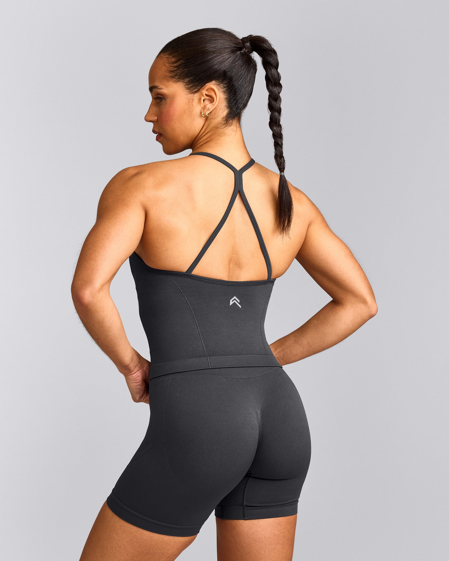 EnhanceLift™ Seamless Strappy Racer Vest with Built in Bra Shelf with Grey Logo | Coal