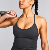 EnhanceLift™ Seamless Strappy Racer Vest with Built in Bra Shelf with Grey Logo | Coal