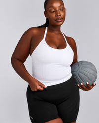EnhanceLift™ Seamless Strappy Racer Vest with Built in Bra Shelf with Grey Logo | White