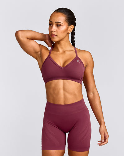EnhanceLift™ Seamless Strappy Sports Bra with Grey Logo | Burnt Maroon