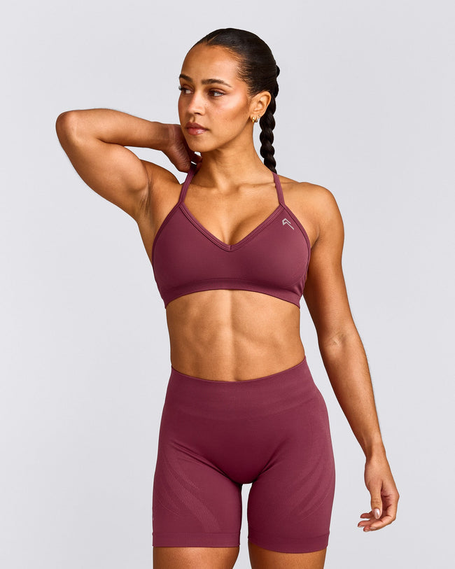 EnhanceLift™ Seamless Strappy Sports Bra with Grey Logo | Burnt Maroon