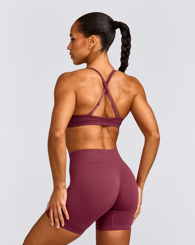 EnhanceLift™ Seamless Strappy Sports Bra with Grey Logo | Burnt Maroon