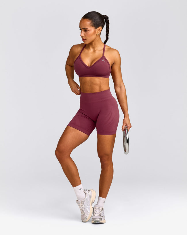 EnhanceLift™ Seamless Strappy Sports Bra with Grey Logo | Burnt Maroon