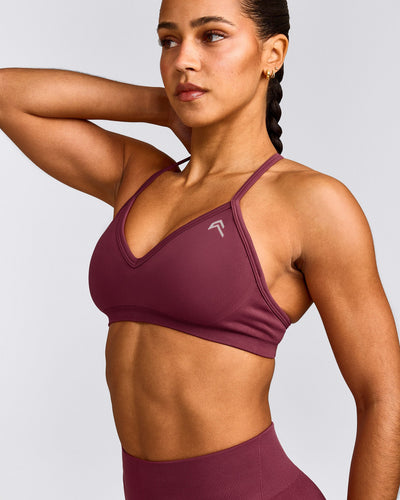 EnhanceLift™ Seamless Strappy Sports Bra with Grey Logo | Burnt Maroon