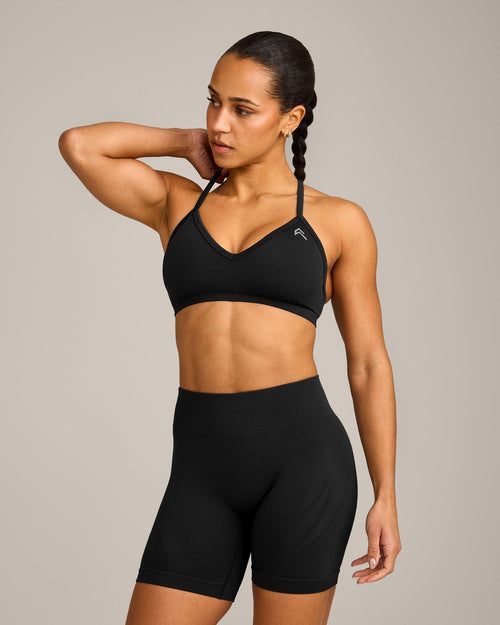 EnhanceLift™ Seamless Strappy Sports Bra with Grey Logo | Black