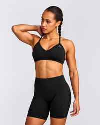 EnhanceLift™ Seamless Strappy Sports Bra with Grey Logo | Black