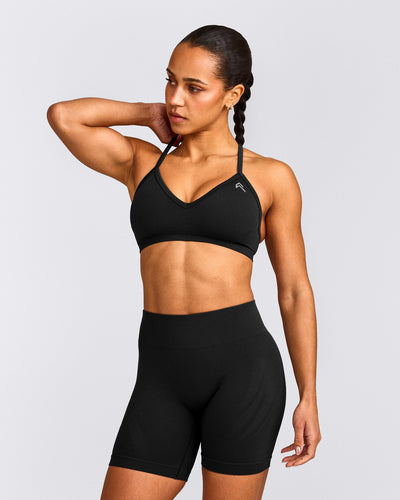 EnhanceLift™ Seamless Strappy Sports Bra with Grey Logo | Black