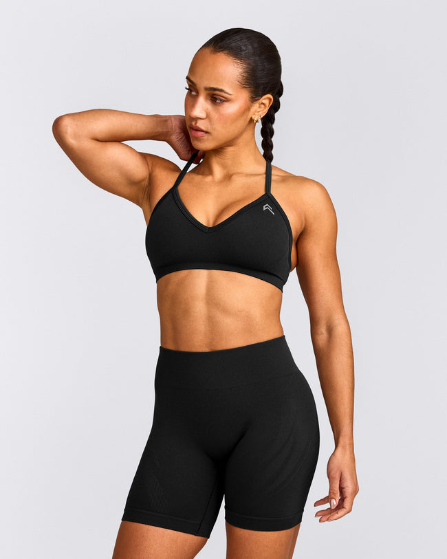EnhanceLift™ Seamless Strappy Sports Bra with Grey Logo | Black