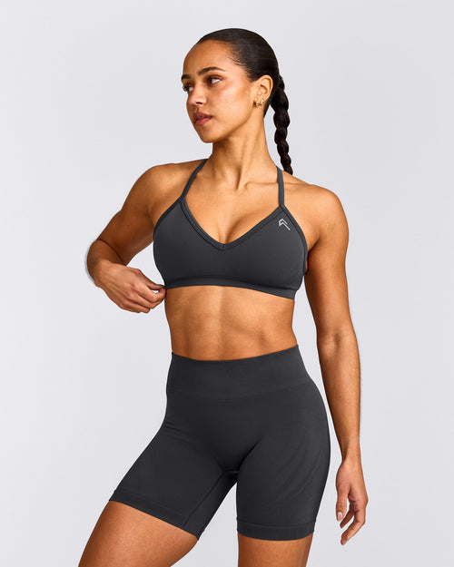 EnhanceLift™ Seamless Strappy Sports Bra with Gray Logo | Coal