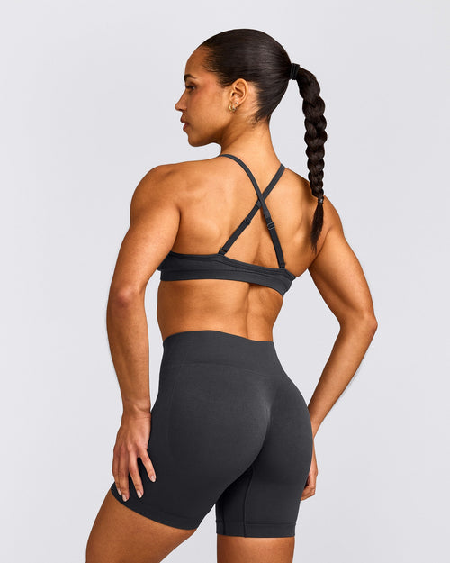 EnhanceLift™ Seamless Strappy Sports Bra with Gray Logo | Coal
