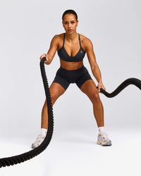 EnhanceLift™ Seamless Strappy Sports Bra with Grey Logo | Coal