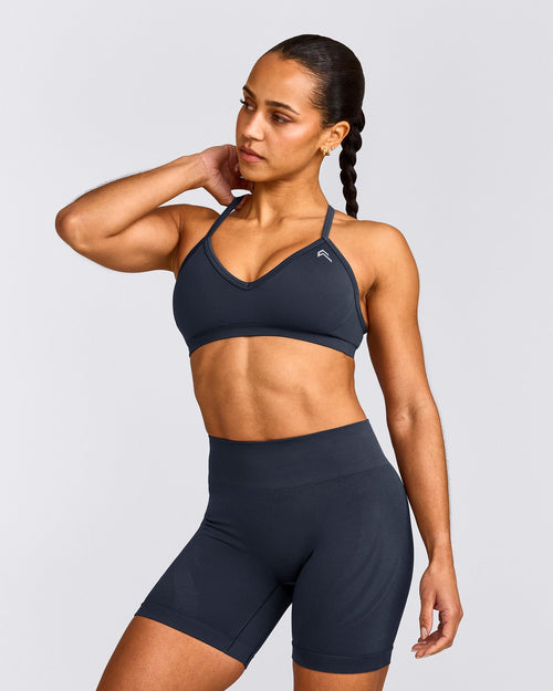 EnhanceLift™ Seamless Strappy Sports Bra with Gray Logo | True Blue