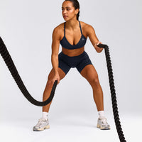 EnhanceLift™ Seamless Strappy Sports Bra with Grey Logo | True Blue