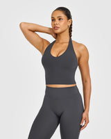 SoftMotion™ Halter Neck Mid Vest with Built in Bra Shelf with White Logo | Coal