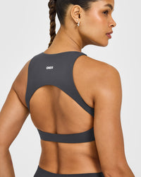 SoftMotion™ High Neck Sports Bra with White Logo | Coal