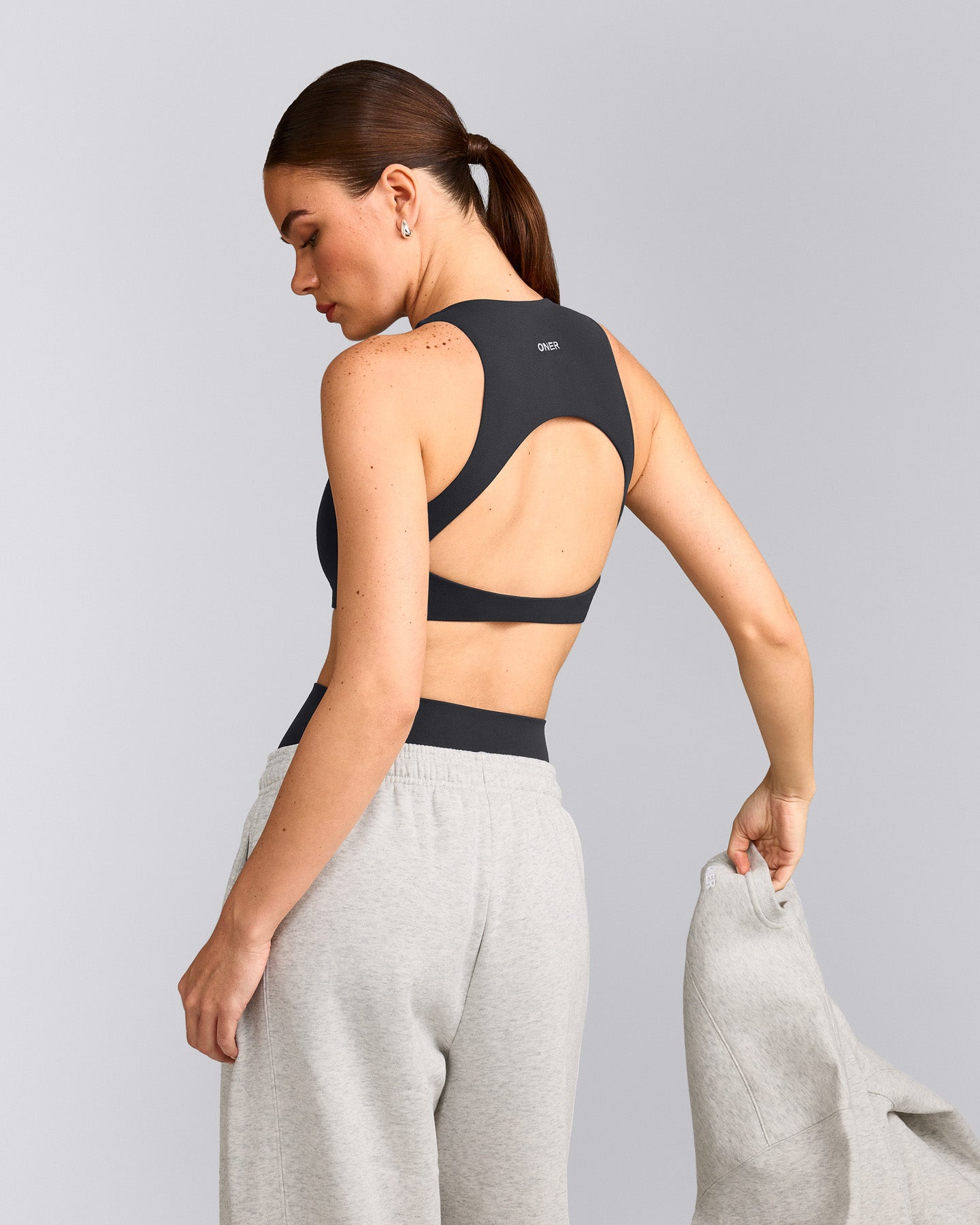 SoftMotion™ High Neck Sports Bra with Grey Logo | Coal